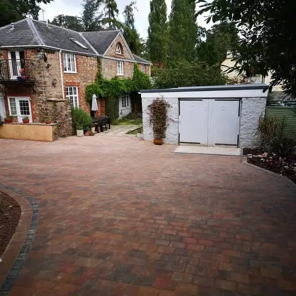 Brick block-paved driveway with planted borders